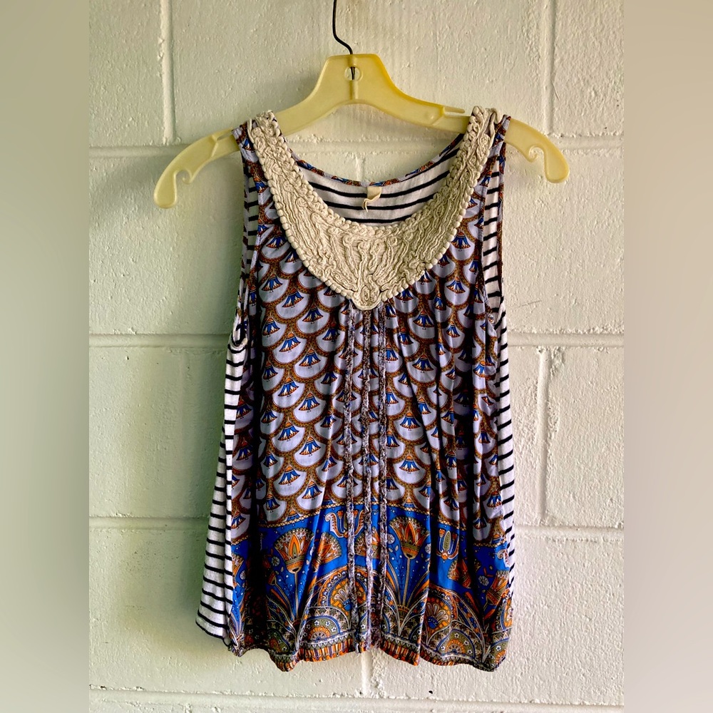 Sleeveless cotton top w/embroidered neck.